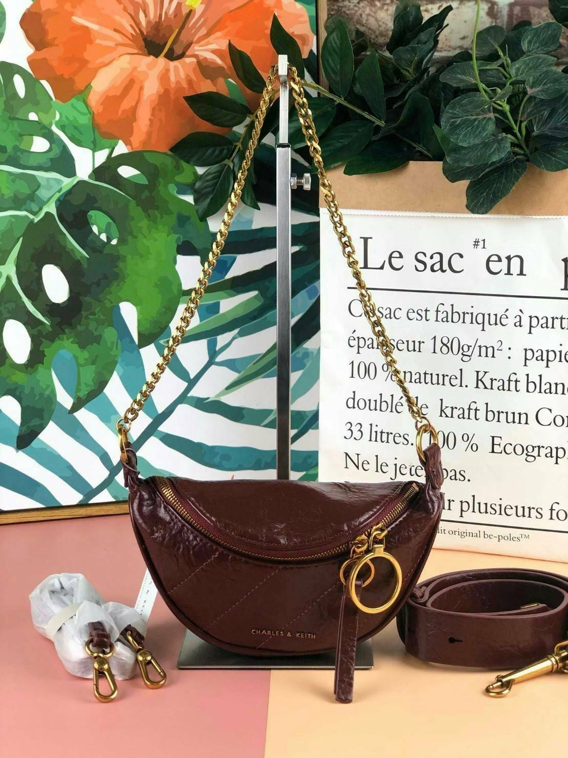 CHARLES & KEITH WRINKLED EFFECT RING ZIP TASSEL CROSSBODY BAG กระเป๋าสาระพัดประโยชน์ ใช้คาเอว คาดอก หรือจะสะพายแบบครอสบอดี้ได้ค่า 💥💥 มีโลโก้แบรนด์ที่ด้านหน้า เปิดปิดแบบซิปคู่เก๋ๆ ด้านในมีช่องใส่บัตรได้ 3 ช่อง รุ่นนี้ใส่ iPhone plus ได้พอดี