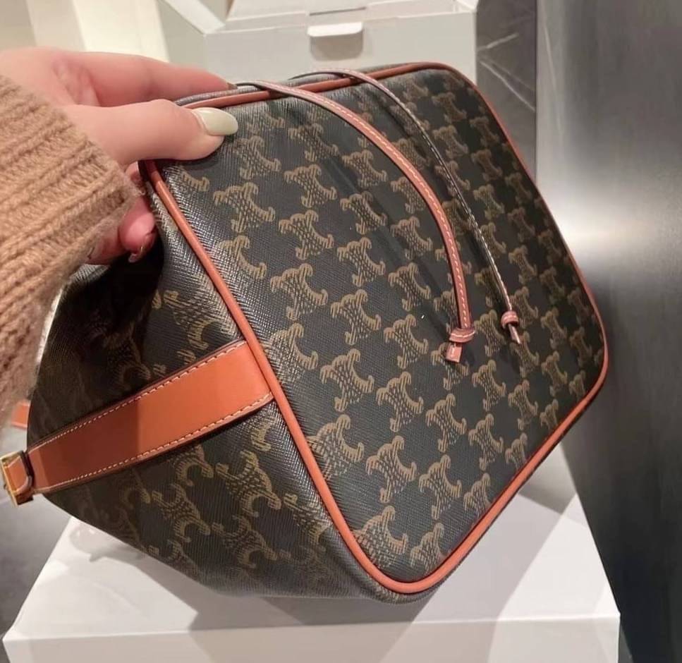 CELINE MEDIUM DRAWSTRING BAG IN TRIOMPHE CANVAS TAN