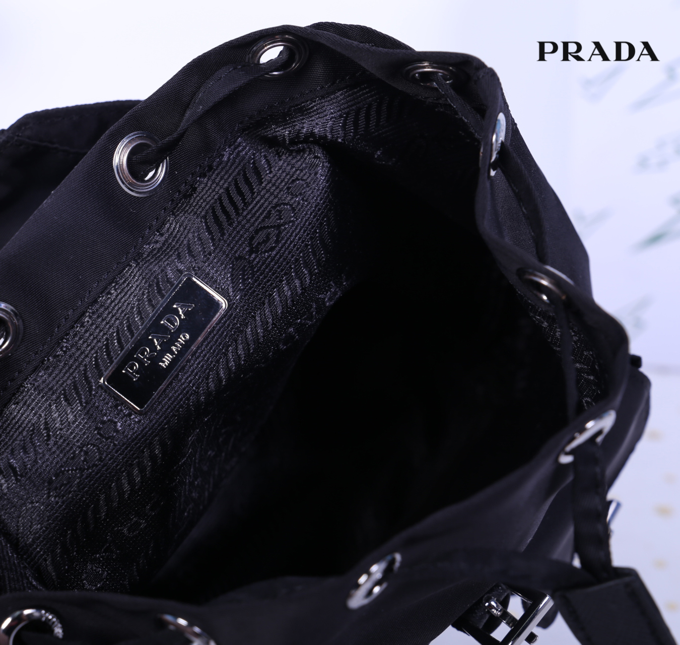 Prada Black Nylon Mini Double Buckle Backpack Crossbody Bag รุ่นนี้เป็นทรงเป้มินิน่ารักๆๆ ด้านในโล่งกว้าง ซับด้านในพิมพ์ลายแบรนด์ ใส่ของจุกจิง โทรศัพท์ กระเป๋าตังใบสั้น เครื่องสำอาง ได้แบบสบาย อะไหล่เงินทั้งใบ บอกเลยว่ารุ่นนี้สวย น่ารัก จะถือหรือสะพายก็ดู