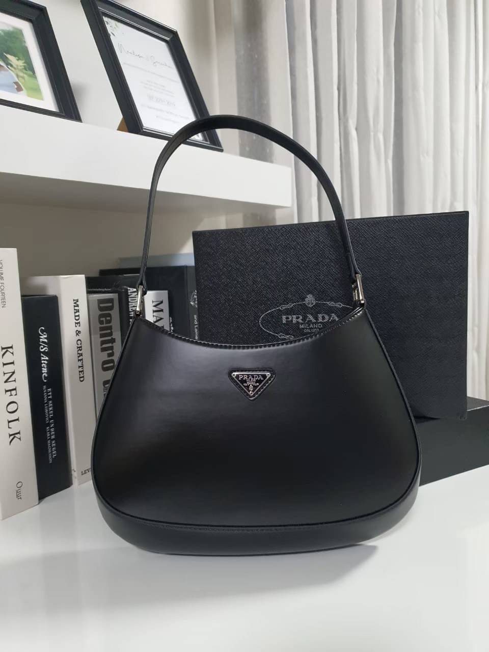 Prada Cleo brushed leather shoulder bag กระเป๋าทรงสวยยอดฮิต กับแบรนด์ PRADA งานพรีเมียมกิ้ฟท์จากแบรนด์ ทรงสะพายไหล่สวยหรูอยู่ทรง PRADA CLEO หนังเรียบดำเงาหรูสุดคลาสสิต เปิดปิดด้วยกระดุมอะไหล่เงินทั้งใบ ด้านในใส่กระเป๋าสตางค์ยาว มือถือ ของจุกจิกได้เยอะ มีป