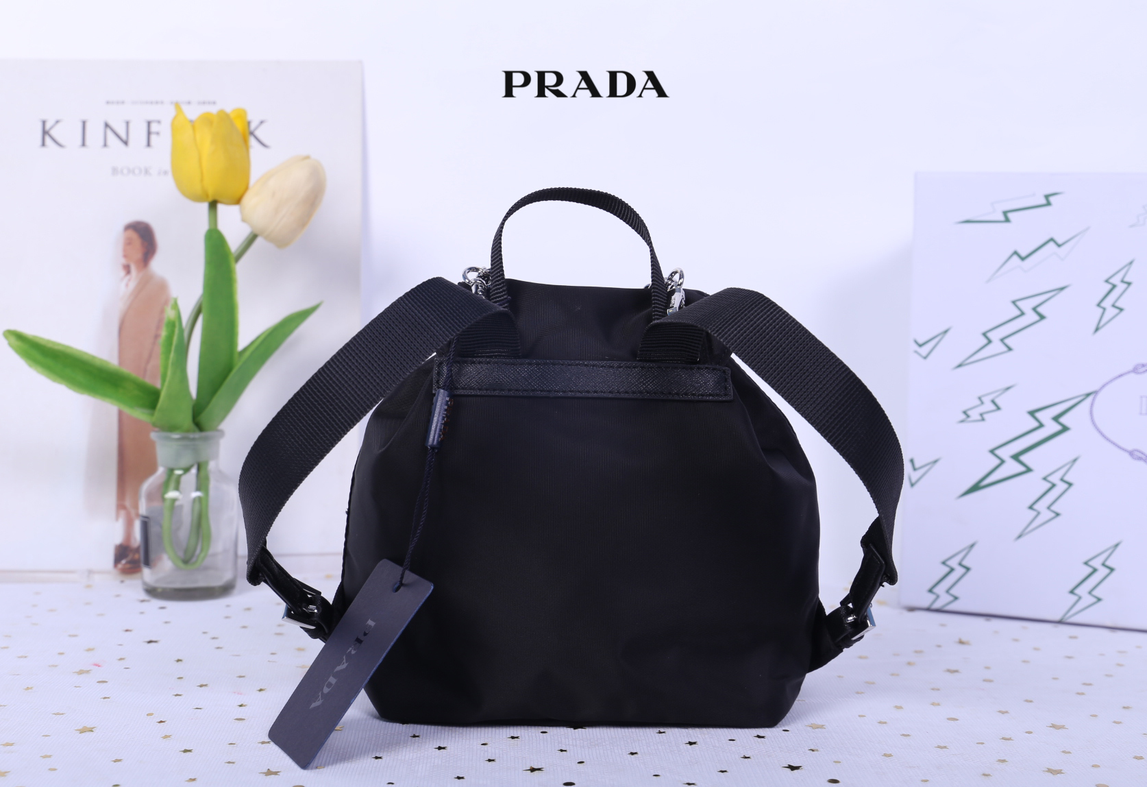 Prada Black Nylon Mini Double Buckle Backpack Crossbody Bag รุ่นนี้เป็นทรงเป้มินิน่ารักๆๆ ด้านในโล่งกว้าง ซับด้านในพิมพ์ลายแบรนด์ ใส่ของจุกจิง โทรศัพท์ กระเป๋าตังใบสั้น เครื่องสำอาง ได้แบบสบาย อะไหล่เงินทั้งใบ บอกเลยว่ารุ่นนี้สวย น่ารัก จะถือหรือสะพายก็ดู