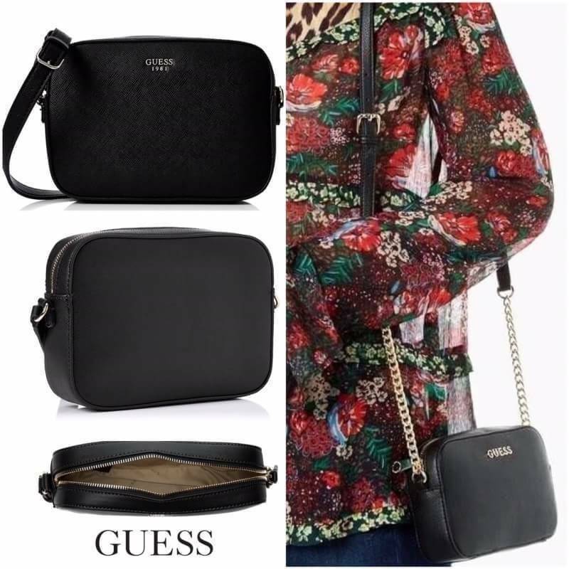 GUESS SAFFIANO SLING BAG กระเป๋าถือหรือสะพายจาก GUESS FACTORY หนัง Saffiano สวยอยู่ทรงขนาดมินิกำลังน่ารัก ด้านหน้าประดับโลโก้แบรนด์อะไหล่เงิน เปิดปิดด้วยซิปสะดวกใช้ ภายในมีโลโก้สามารถใส่มือถือiphone8+ ของจุกจิกได้ มาพร้อมสายสะพายโซ่ต่อหนังปรับไม่ได้ Cross