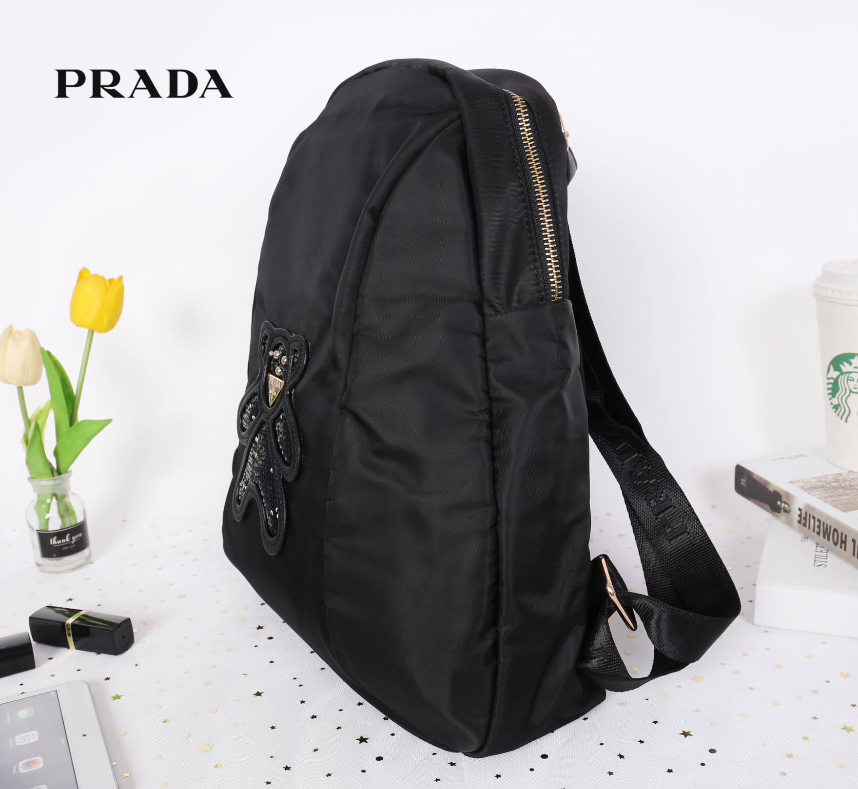 PRADA NYLON Bear BACKPACK กระเป๋าสะพายเป้ Premium gift จากเคาน์เตอร์ต่างประเทศรุ่น Limited edition วัสดุเป็น Nylon เนื้อหนาคุณภาพดีตามแบบฉบับของแบรนด์ ขนาดกำลังดี น้ำหนักเบา ด้านหน้าเป็นลายหมีปั๊กกลิ้ตเตอร์โลโก้แบรนด์ อะไหล่ทองหรูภายในซับ Polyester 100% ม