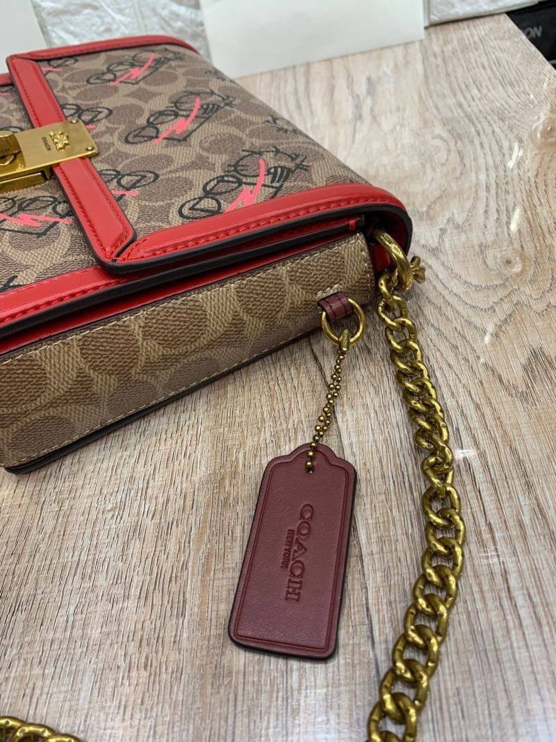 COACH HUTTON SHOULDER BAG IN SIGNATURE CANVAS