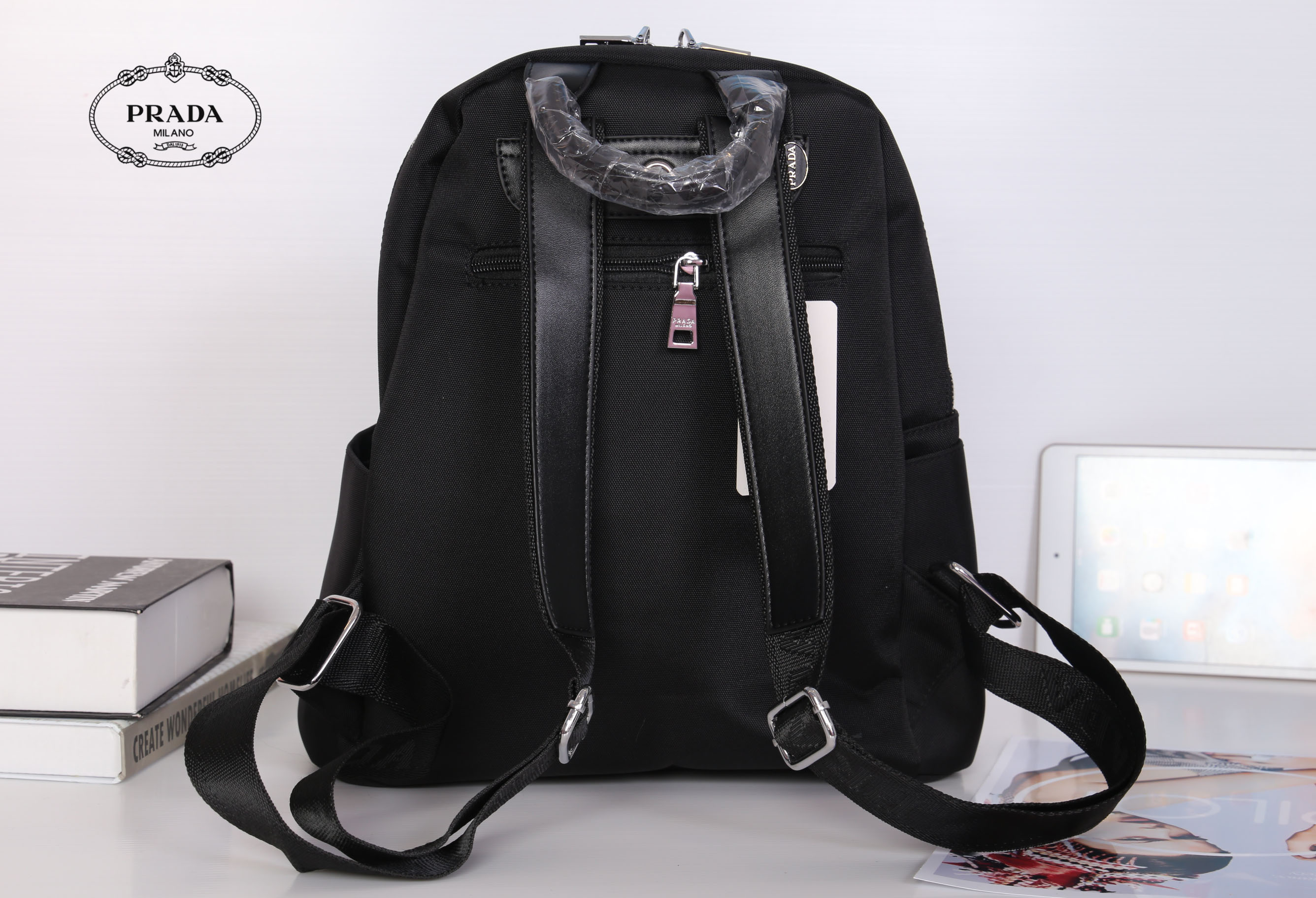 PRADA NYLON BACKPACK กระเป๋าเป้ Limited edition VIP Gift With Purchase (GWP) จากเคาน์เตอร์แบรนด์วัสดุ Nylon&Polyester เนื้อหนาคุณภาพดี น้ำหนักเบา ด้านหน้าประดับโลโก้แบรนด์ เปิดปิดด้วยซิป หูจับคุณภาพดีแข็งแรง สายสะพายหลังลายแบรนด์เลื่อนปรับได้ ด้านในโล่งกว