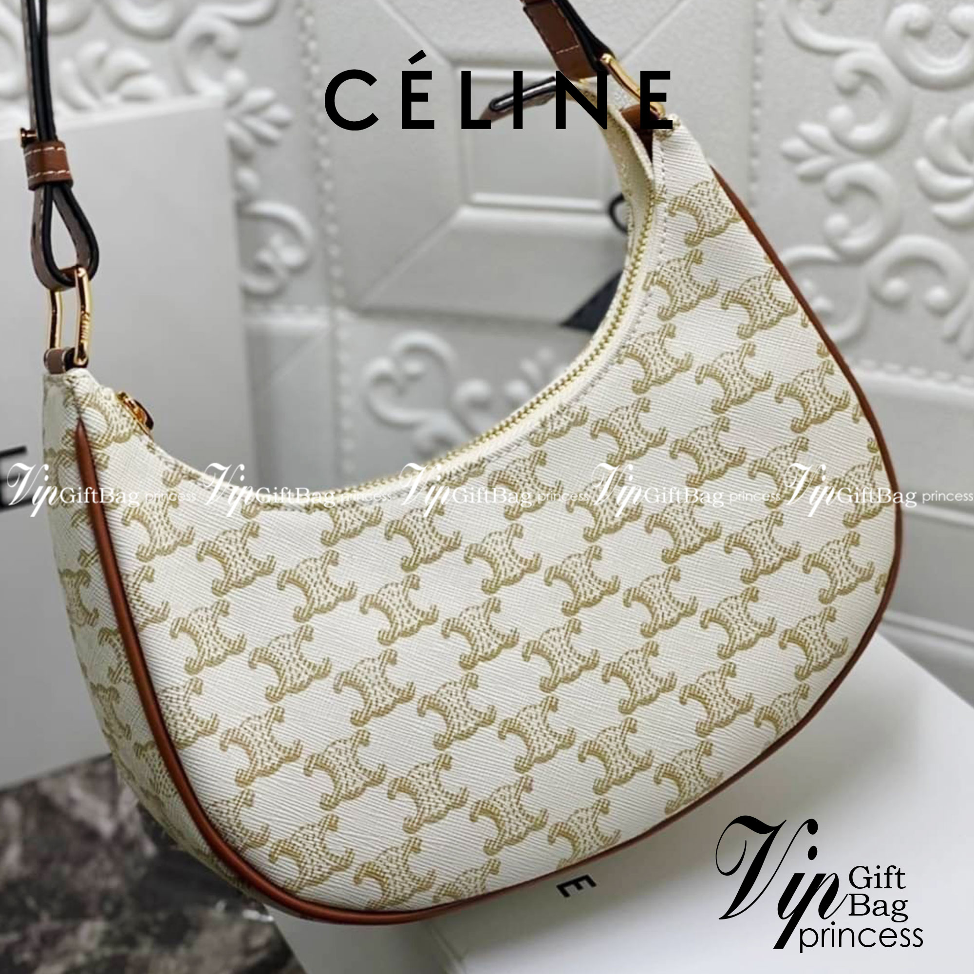 หนังแท้ CELINE AVA / CELINE Vintage Classic Ava bag 1 ใน คอลเลคชั่น “Triomphe Canvas” มาพร้อมสายสะพายไหล่ที่ปรับความยาวได้ และเนื่องจากช่วงล่างของกระเป๋ามีขนาดใหญ่กว่าช่วงบน จึงทำให้ไม่เสียทรงเมื่อเราใส่สิ่งของอย่างกระเป๋าสตางค์หรือโทรศัพท์มือถือ หากดูภาพ
