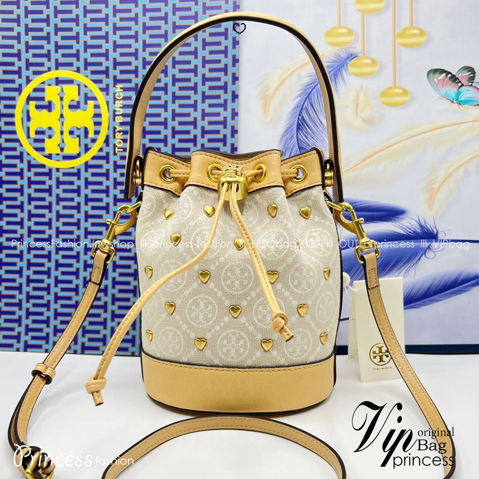 TORY BURCH T MONOGRAM EMBELLISHED MINI BUCKET BAG NEW IVORY MULTI กระเป๋าทรงบัคเก็ตแต่งหัวใจสีทองสวยหรู น่ารักรุ่นใหม่ล่าสุด เกรดท็อปออริ เทียบแท้ 1:1 เกรดดีสุด ใช้งานต่างประเทศได้