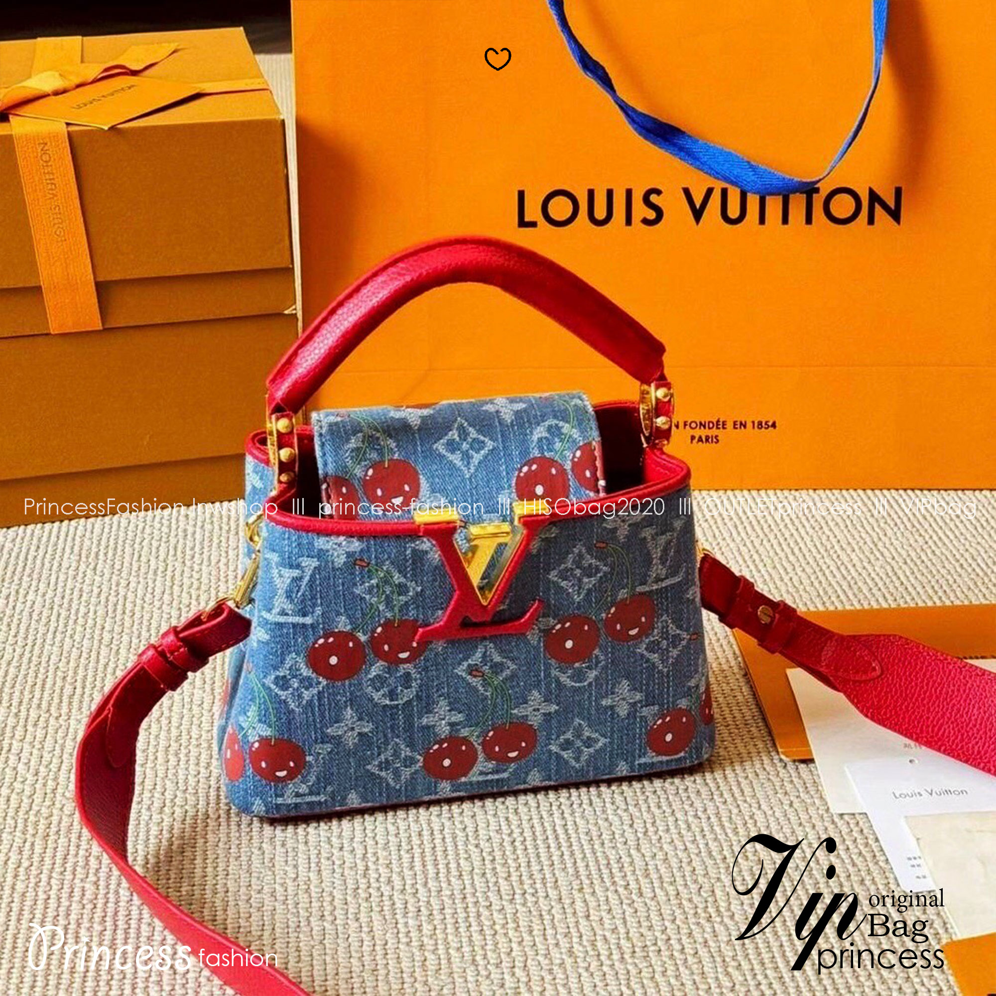 LV Capucines Monogram cherry denim กระเป๋าถือสุดหรูรูปทรงสวยคลาสสิกมาพร้อมหูจับในตัว สวยคมสะกดทุกสายตา ที่สุดของความสวยในราคาเบาๆ โดดเด่นมีชีวิตชีวา ด้วยเดนิมวินเทจปักลายเชอร์รี่สีสันสดใสสะดุดตาสะท้อนสไตล์ไอคอนิก