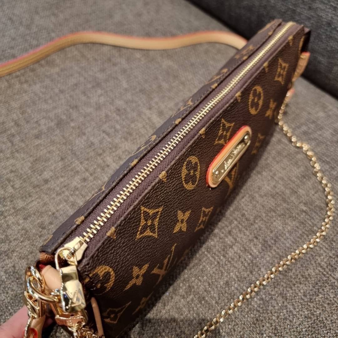 LV CROSSBODY CLUTCH BAG WITH CHAIN / LV Eva Clutch Crossbody Bag กระเป๋าสะพายวีไอพีพรีเมี่ยม วัสดุหนังแคนวาสคุณภาพ โลโก้เพลทอะไหล่ทอง คมชัด หรูหรา เปิด-ปิดกระเป๋าด้วยซิป ภายในเป็นช่องโล่ง ใส่ของใช้สำคัญได้สบายๆ มือถือ พาวเวอร์แบงค์ เครื่องสำอางค์ ของจุกจิ