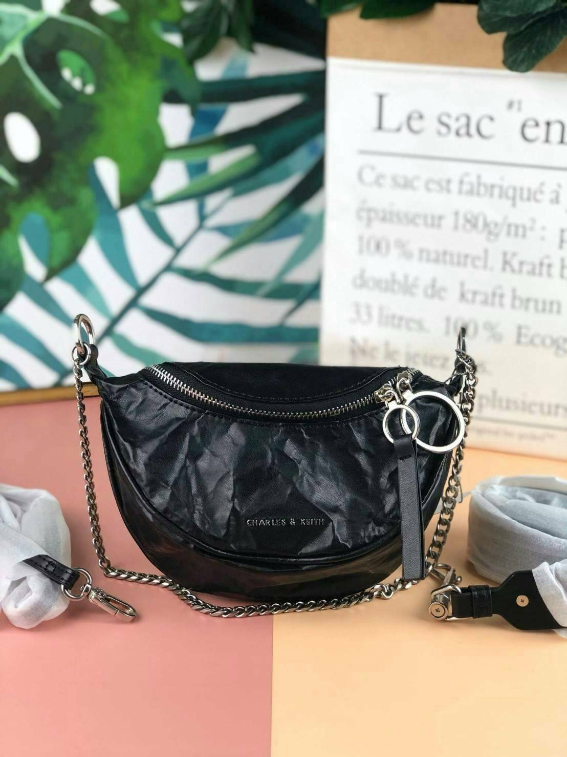 CHARLES & KEITH WRINKLED EFFECT RING ZIP TASSEL CROSSBODY BAG กระเป๋าสาระพัดประโยชน์ ใช้คาเอว คาดอก หรือจะสะพายแบบครอสบอดี้ได้ค่า 💥💥 มีโลโก้แบรนด์ที่ด้านหน้า เปิดปิดแบบซิปคู่เก๋ๆ ด้านในมีช่องใส่บัตรได้ 3 ช่อง รุ่นนี้ใส่ iPhone plus ได้พอดี