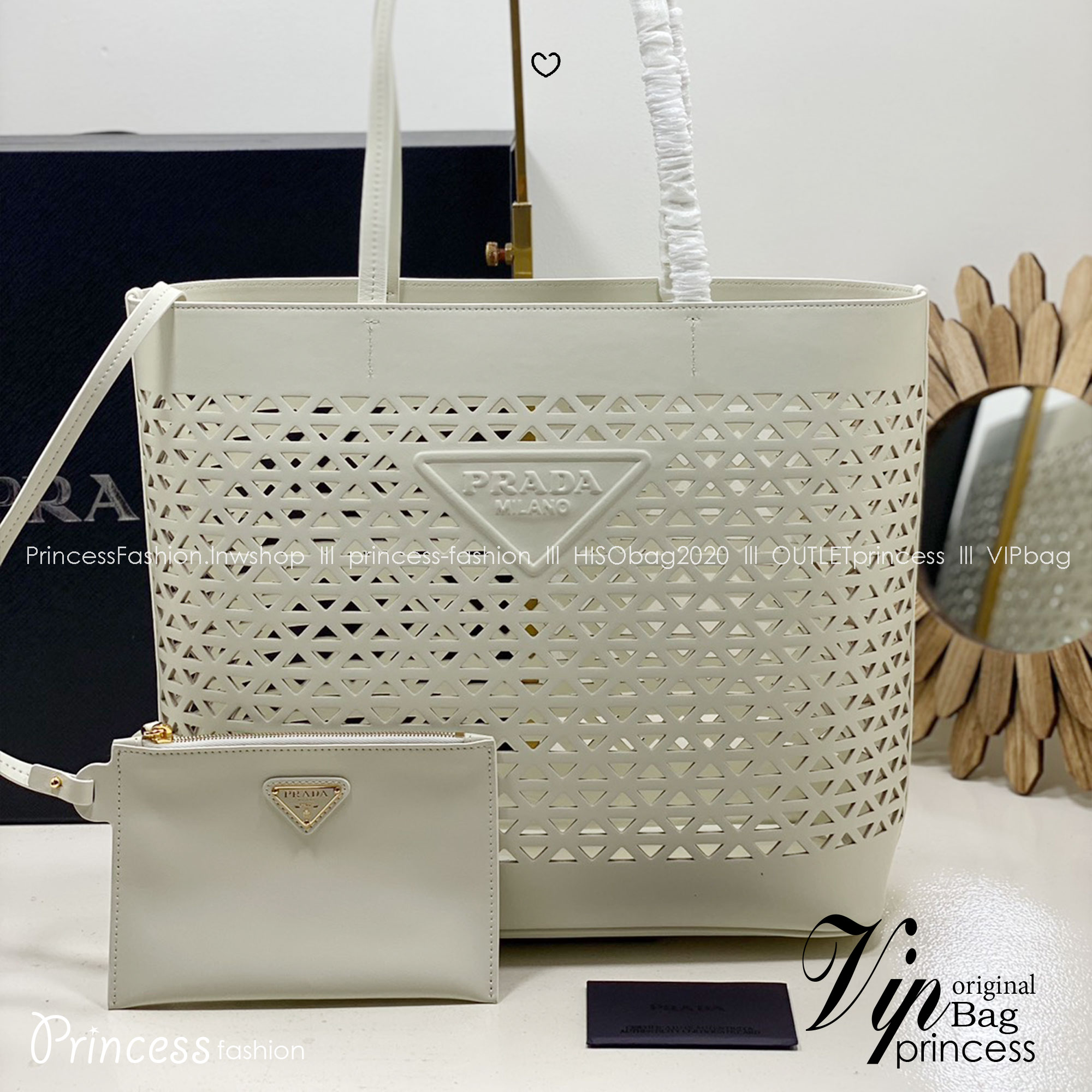TOP ORI หนังแท้ | Prada Large perforated leather tote bag กระเป๋าทรงโท้ทใบใหญ่ ใจบางที่สุดกับคอลเลคชั่นนี้ ที่เพิ่มดีเทลความแพงด้วยการฉลุลวดลายรอบใบ ถักทอเป็นเส้นลายสานที่สวยงามมาก งานฝีมือจริงๆ