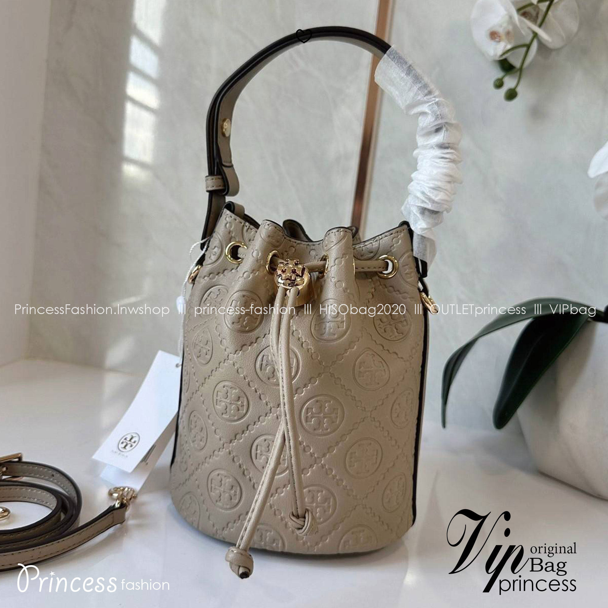TORY BURCH mini T Monogram leather bucket bag กระเป๋าบัคเกต ไซต์ mini คอลเลกชันหนัง T Monogram ลายซิกเนเจอร์หนังปั้มลายนูน
