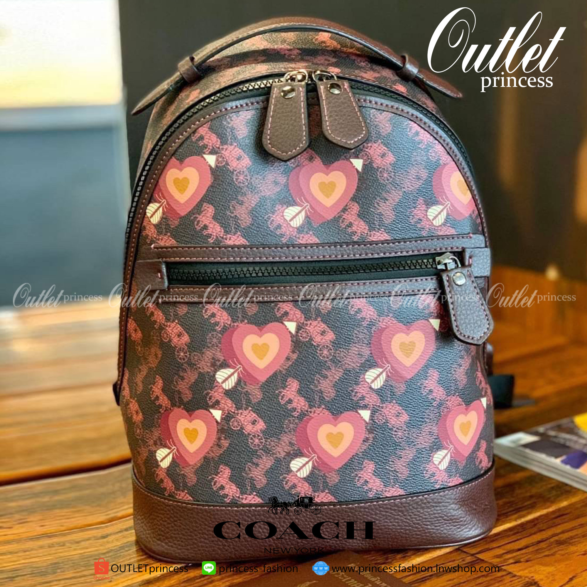 COACH BACKPACK WITH HORSE AND CARRIAGE PRINT AND HEARTS