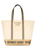 Victoria's Secret Canvas Tote Bag กระเป๋าสะพายวัสดุแคสวาสสีครีม ด้านล่างเป็นกลิตเตอร์ สกรีนชื่อแบรนด์ ฐานกระเป๋าเป็นหนัง ด้านหน้ามีช่องเล็กไว้ใส่ของได้ เปิดปิดด้วยซิป ซับในลายแบรนด์ มีช่องซิปเล็กแยกใส่ของ1ช่อง จุของได้เยอะมาก
