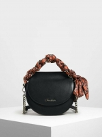 CHARLES & KEITH รุ่น LEATHER SATIN SCARF CROSSBODY BAG SL2-50150828 ราคาปกติช้อป ( ฿3,590.00 ) กระเป๋าถือ และ สะพาย ทรงโค้งมน หนังเรียบ ตั้งอยู่ทรง ด้านหน้าติดโลโก้แบรนด์ อะไหล่เงิน หูจับสายกระเป๋าร้อยเข้ากับห่วงเหล็กกลมๆ ด้วยผ้าลายสวยงามผูกเป็นโบว์เก๋ๆ ถ