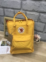 Kanken backpack รุ่น Classic แบรนด์ดังจากสวีเดนที่นิยมกันมากในหมู่วัยรุ่น กระเป๋าเป้ที่มีน้ำหนักเบา แต่มีความทนทาน และช่องว่างต่างๆมากขึ้น มีซิปหน้าสำหรับใส่ของกระจุกกระจิก และหูหิ้วทั้งด้านหน้าและด้านหลัง สำหรับการหิ้วถือได้สะดวก ใส่มินิไอแพค กระเป๋าสตาง