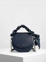 CHARLES & KEITH รุ่น LEATHER SATIN SCARF CROSSBODY BAG SL2-50150828 ราคาปกติช้อป ( ฿3,590.00 ) กระเป๋าถือ และ สะพาย ทรงโค้งมน หนังเรียบ ตั้งอยู่ทรง ด้านหน้าติดโลโก้แบรนด์ อะไหล่เงิน หูจับสายกระเป๋าร้อยเข้ากับห่วงเหล็กกลมๆ ด้วยผ้าลายสวยงามผูกเป็นโบว์เก๋ๆ ถ