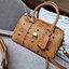 M.C.M ESSENTIAL BOSTON BAG IN VISETOS กระเป๋าถือ/สะพายข้าง ทรงหมอน สวยโดดเด่น ทรงสวยยอดนิยม มาพร้อมพวงหนังห้อย และสายรัดเก็บหูจับ วัสดุหนังแคนวาสคุณภาพดี เปิด-ปิดด้วยซิป ภายในเป็นหนังกลับ โล่งกว้าง ใส่ของได้เยอะ กระเป๋าสตางค์ โทรศัพท์ ของจุกจิกต่างๆ สบาย!