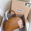 MIU MIU HALF-MOON TOP HANDLE BAG / Patent leather bowling bag / Miu Miu Leather top-handle bag กระเป๋าทรงพระจันทร์เสี้ยว หนังนิ่ม ลื่นเงา ตัดกับอะไหล่ทองได้ลงตัว