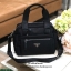 PRADA NYLON BOWLING BAG GIFT WITH PURCHASE GWP Limited edition พรีเมี่ยมกิ้ฟจากเคาน์เตอร์แบรนด์ต่างประเทศวัสดุ Nylon เนื้อหนาคุณภาพดีตามแบบฉบับแบรนด์ ด้านหน้ามี2ช่องซิปและโลโก้แบรนด์ ด้านข้างมีช่องใส่ของ ด้านหลังมี1ช่องซิป หูจับสะพายไหล่ได้ พร้อมสายสะพายย