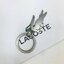 LACOSTE MEN'S Black Wallet And Key Ring Set ในเซตประกอบด้วยกระเป๋าสตางค์แบบพับ2ตอนสำหรับผู้ชาย มีช่องใส่บัตร ใส่ธนบัตรและช่องใส่เหรียญแยกเป็นสัดส่วน มาพร้อมพวงกุญแจโลหะจระเข้สัญลักษณ์แบรนด์ น่าใช้มากๆนะคะ