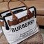 BURBERRY FRAGRANCES TOTE BAG อีกหนึ่งไอเท็มหายาก วัสดุ Canvas & Leather Calfskin ดีไซน์สวยมีเอกลักษณ์คาดด้วยสายหนังประดับกระดุมทองด้านหน้า หูจับหนังแท้จับถนัดมือ สายสะพายยาวหนังแท้ถอดได้ปรับระดับได้อะไหล่แบรนด์ ภายในโล่งกว้างมีช่องใส่ของใส่เอกสารA4 กระเป๋