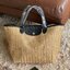 LONGCHAMP LE PLIAGE COLLECTION PAILLE TOP HANDLE BAG มี 3 ขนาด XS/S/M กระเป๋าถือหรือสะพาย งานสาน raffia ปากกระเป๋าตัดด้วยหนังสีดำ ลุคช์สุดเท่ของเหล่า Celebrities กับกระเป๋าปิคนิกสุดฮิตจาก Longchamp อย่าง Le Pliage Paille (เลอ ปลิยาจ ไพล์) ถือเป็นกระเป๋าที