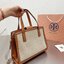 TORY BUTCH SMALL WALKER CANVAS กระเป๋าถือ สะพาย ดีไซสน์สวย เป็นเอกลักษณ์ วันดุผ้า CANVAS ด้านนอกประดับโลโก้แบรนด์ด้านหน้า ตัดด้วยหนังแท้รอบใบ ด้านในเปิดปิดด้วยหนังคาดกระดุมแม่เหล็ก แบ่งของใส่ของเป็นสองช่องใหญ่ พร้อมข่องซิปกลาง สามารถใส่ไอแพด กระเป๋าสตางค์