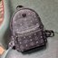 SMALL M.C.M STARK STUDS SMALL BACKPACK IN VISETOS Best seller Unisex backpack กระเป๋าเป้ดีไซน์เอกลักษณ์ รุ่นขายดี ใช้ได้ทั้งหนุ่มๆและสาวๆ ตกแต่งหมุดอะไหล่สี gun metal เรียบหรู วัสดุหนังแคนวาสคุณภาพดี เปิด-ปิดด้วยซิป ภายในโล่งกว้าง จุของได้เยอะ สายสะพายสาม