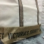 Victoria's Secret Canvas Tote Bag กระเป๋าสะพายวัสดุแคสวาสสีครีม ด้านล่างเป็นกลิตเตอร์ สกรีนชื่อแบรนด์ ฐานกระเป๋าเป็นหนัง ด้านหน้ามีช่องเล็กไว้ใส่ของได้ เปิดปิดด้วยซิป ซับในลายแบรนด์ มีช่องซิปเล็กแยกใส่ของ1ช่อง จุของได้เยอะมาก