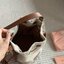 MIU MIU Canvas and leather bucket bag / MIU MIU Bucket Bag กระเป๋าทรงบัคเก็ต ผ้าแคนวาสอย่างดีตกแต่งโลโก้เพิ่มสัมผัสอันเป็นเอกลักษณ์