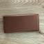 Charles & Keith Basic Long Wallet กระเป๋าสตางค์ใบยาว ตกแต่งด้วยพู่ เปิด – ปิดกระเป๋าด้วยเเม่เหล็กแบบซ่อน ภายในมีช่องใส่บัตร ช่องซิปใส่เหรียญ และช่องใส่ธนบัตร ใส่ iPhone Plus ได้ค่ะ ด้านหลังมีช่อง 1 ช่อง