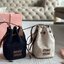 MIU MIU Canvas and leather bucket bag / MIU MIU Bucket Bag กระเป๋าทรงบัคเก็ต ผ้าแคนวาสอย่างดีตกแต่งโลโก้เพิ่มสัมผัสอันเป็นเอกลักษณ์