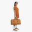 M.C.M TRAVELER WEEKENDER IN VISETOS จัดให้แล้วจ้า สายแคมป์ปิ้ง สายสปอร์ต สายลุย ใบนี้เอาอยู่แน่นอน!! กระเป๋าเดินทาง ใบใหญ่จุใจ ดีไซน์คลาสสิคสไตล์แบรนด์ มาพร้อม tag หนังห้อย พร้อมกุญแจสำหรับล็อคซิป วัสดุหนังแคนวาสคุณภาพดีเต็มใบ และมีหมุดรองก้นกระเป๋าและสาย