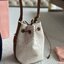 MIU MIU Canvas and leather bucket bag / MIU MIU Bucket Bag กระเป๋าทรงบัคเก็ต ผ้าแคนวาสอย่างดีตกแต่งโลโก้เพิ่มสัมผัสอันเป็นเอกลักษณ์