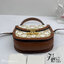 CELINE Mini besace triomphe in shiny top handle กระเป๋าสะพายคาดลำตัวพร้อมหูจับถนัดมือ ได้รับความนิยมอย่างมาก ด้วยรูปร่างทรงโค้งมนมีความคลาสสิกตามแบบฉบับแบรนด์