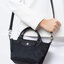 LONGCHAMP LE PLIAGE NÉO TOP HANDLE BAG XS คอลเลคชั่นสุดพิเศษจากลองฌอมป์ มีดีไซน์ที่เรียบหรูและคลาสสิก แฝงด้วยลูกเล่นแบบเฟมินีน แถมยังมีน้ำหนักเบาอย่างไม่น่าเชื่อ มาพร้อมกับหูจับกระเป๋าคู่และฝาปิดแบบกระดุม กระเป๋าถือใบนี้สามารถใช้ถือแบบทั่วไป มีสายสะพายถอด