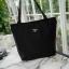 ReStock! งานขายดี ได้ กระเป๋าสะพายไหล่ ทรง TOTE จากแบรนด์ PRADA มาค่า เป็น กระเป๋าผ้าไนล่อน ตามแบบฉบับของแบรนด์เลย ใบนี้มีสายยาวให้ค่ะ สะพายเป็น shoulder bag หรือ ถือได้ค่ะ ด้านหน้าเป็นลายหมี ปักกลิ้ตเตอร์ +logo brand ใช้แล้วสวยมากๆ อะไหล่ทองหรูมาก จุของค