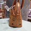 M.C.M SMALL ANNA TOTE คอลเลคชั่นใหม่ดีไซน์ไม่ซ้ำใคร รุ่นนี้เป็น seasonal หายากไปอีก กระเป๋าถือ/สะพายข้าง ทรงยูนีคโดดเด่น น่าใช้ หูจับในตัวมาพร้อมสายรัดเก็บ วัสดุหนังแคนวาสคุณภาพดี ตกแต่งตัวกดล็อคเอกลักษณ์ เปิด-ปิดด้วยซิป ภายในเป็นช่องโล่ง ใส่ของได้สบายๆ ต