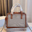 TORY BUTCH SMALL WALKER CANVAS กระเป๋าถือ สะพาย ดีไซสน์สวย เป็นเอกลักษณ์ วันดุผ้า CANVAS ด้านนอกประดับโลโก้แบรนด์ด้านหน้า ตัดด้วยหนังแท้รอบใบ ด้านในเปิดปิดด้วยหนังคาดกระดุมแม่เหล็ก แบ่งของใส่ของเป็นสองช่องใหญ่ พร้อมข่องซิปกลาง สามารถใส่ไอแพด กระเป๋าสตางค์