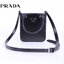 PRADA Small brushed leather tote กระเป๋าTote ขนาดเล็กที่มีดีไซน์ทรงเหลี่ยมโฉบเฉี่ยว วัสดุจากหนังเงาซึ่งเป็นวัสดุที่โดดเด่นของแบรนด์มาตั้งแต่ยุค 90'