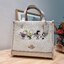 Coach X Peanuts Dempsey Tote 22 With Snoopy And Friends Motif CE850 คอลเลคชั่นใหม่ น้องน่ารักเกินต้านไปมาก!! กับกระเป๋าทรงโท้ท ไซส์กำลังสวย ดีไซน์ ลายการ์ตูนยอดฮิต ที่ใครๆก็ต้องรู้จัก พิมพ์คมชัดลงบนหนัง pepble ผิวสัมน่าใช้ ปากกระเป๋ามีกระดุมแม่เหล็กปิดกัน