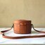 CELINE MEDIUM TAMBOUR IN SMOOTH CALFSKIN BAG กระเป๋าทรงกลมสวยหรูอยู่ทรงเปิดปิดด้วยฝาปิดกระดุมโลโก้แบรนด์ ภายในโล่ง