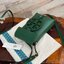 TORY BURCH MILLER METAL PHONE CROSSBODY อีกหนึ่งกระเป๋าใส่มือถือรุ่นฮิตที่เชื่อว่าหลาย ๆ คนต้องเคยเห็นผ่าน ๆ ตามาอย่างแน่นอน กับแบรนด์ Tory Burch ดีไซน์กระเป๋าทรงฝาพับแม่เหล็กใช้งานง่าย มาพร้อมดีเทล Logo สีเดียวกับเฉดสีของกระเป๋า แต่ยังมีความน่ารักด้วยทรง