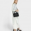 CHARLES & KEITH BASIC TOP HANDLE BAG กระเป๋าถือหรือสะพายรุ่นใหม่ชน shop ดีไซน์สวย อยู่ทรง ขนาดกำลังดี น้ำหนักเบา ด้านหน้าประดับโลโก้แบรนด์ เปิดปิดด้วยซิปสะดวกใช้ ด้านข้างมีสายรัดปรับทรงกระเป๋าค่ะ ภายในมีช่องซิป ใส่กระป๋าสตางค์ใบยาว mini iPad ได้ค่ะ มีหมุด