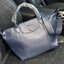Longchamp Le Pliage Cuir Top handle bag S เรียกว่าเป็นกระเป๋าอีกหนึ่งรุ่นที่ไม่ว่ายังไงก็ฮอตฮิตและติดเทรนด์ตลอดไม่เคยเปลี่ยนกับ ทรง Le Pliage Cuir หนึ่งในตระกูลกระเป๋าสุดไอคอนิกจากแบรนด์