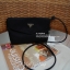 Best Seller! จากงานพรีเมี่ยมกิ้ฟ จากเคาเตอร์ต่างประเทศ จากแบรนด์ PRADA ค่า เป็น กระเป๋าผ้าไนล่อน ตามแบบฉบับของแบรนด์เลย ใบนี้มีสายยาวให้คะ เลิศมาก สะพายเป็น shoulder bag ได้เลย ขนาดกำลังดีคะ ตัวกระเป๋าเบามาก ใส่มือถือได้ทุกรุ่น ใช้แล้วสวยมากๆ อะไหล่ทองหรู