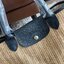 LONGCHAMP LE PLIAGE COLLECTION PAILLE TOP HANDLE BAG มี 3 ขนาด XS/S/M กระเป๋าถือหรือสะพาย งานสาน raffia ปากกระเป๋าตัดด้วยหนังสีดำ ลุคช์สุดเท่ของเหล่า Celebrities กับกระเป๋าปิคนิกสุดฮิตจาก Longchamp อย่าง Le Pliage Paille (เลอ ปลิยาจ ไพล์) ถือเป็นกระเป๋าที