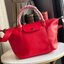 Longchamp Le Pliage Cuir Top handle bag S เรียกว่าเป็นกระเป๋าอีกหนึ่งรุ่นที่ไม่ว่ายังไงก็ฮอตฮิตและติดเทรนด์ตลอดไม่เคยเปลี่ยนกับ ทรง Le Pliage Cuir หนึ่งในตระกูลกระเป๋าสุดไอคอนิกจากแบรนด์
