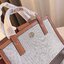 TORY BUTCH SMALL WALKER CANVAS กระเป๋าถือ สะพาย ดีไซสน์สวย เป็นเอกลักษณ์ วันดุผ้า CANVAS ด้านนอกประดับโลโก้แบรนด์ด้านหน้า ตัดด้วยหนังแท้รอบใบ ด้านในเปิดปิดด้วยหนังคาดกระดุมแม่เหล็ก แบ่งของใส่ของเป็นสองช่องใหญ่ พร้อมข่องซิปกลาง สามารถใส่ไอแพด กระเป๋าสตางค์